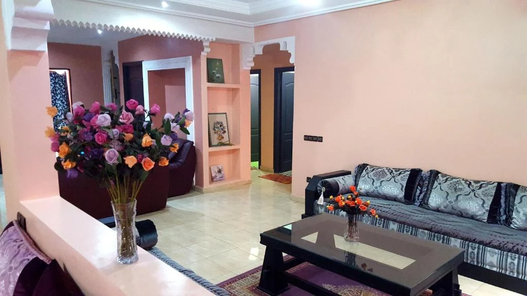 Living room with floral decoration at Villa Annakhil Marrakech